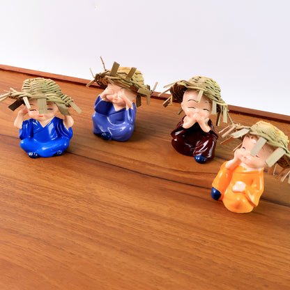 Decorative Resin Monk Buddha Showpiece Set Of 4 With Traditional Straw Hats